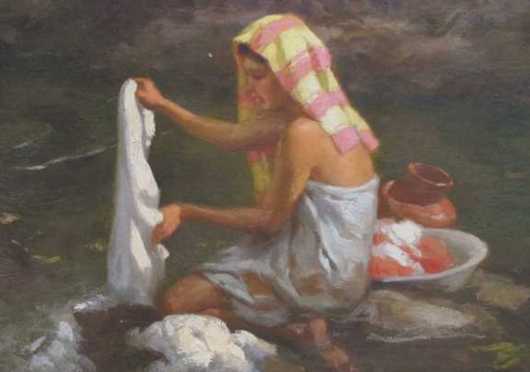 Fernando Amorsolo oil on board of a young woman washing clothing in a stream