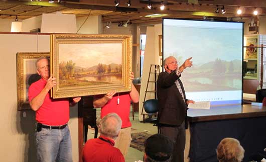 charlie cobb auctioning a painting