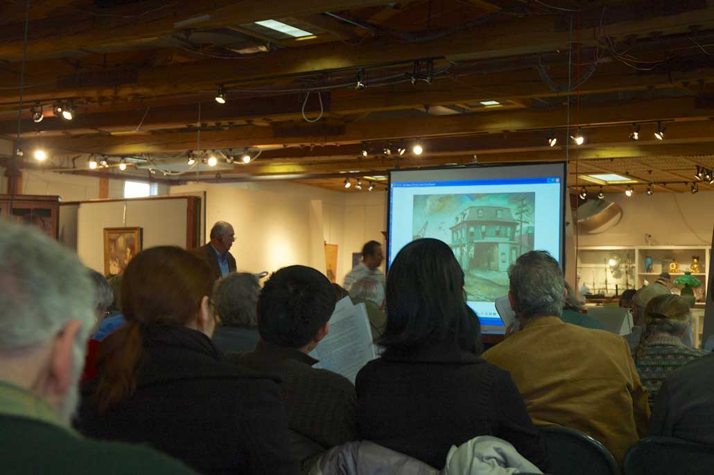 buyers watching and bidding in the cobbs auction hall